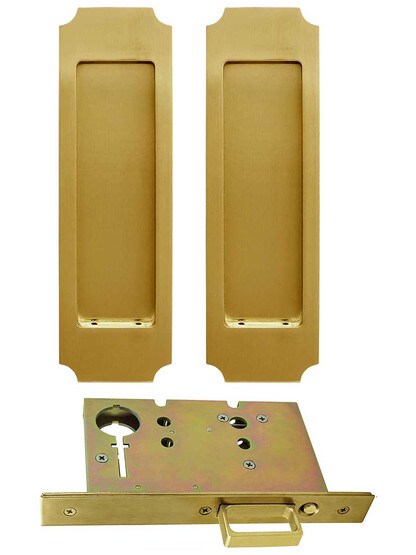 Premium Pocket-Door Mortise Lock Set with Chamfered Corner Pulls in Aged Brass.